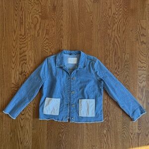Denim shirt/jacket with snap front and pleather pockets.